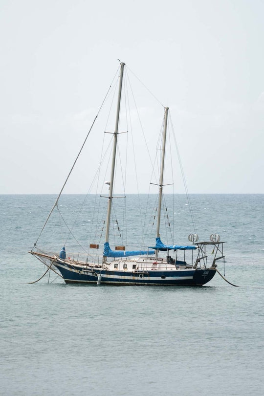 Sailing boat anchored in the sea along Sao Tome Island