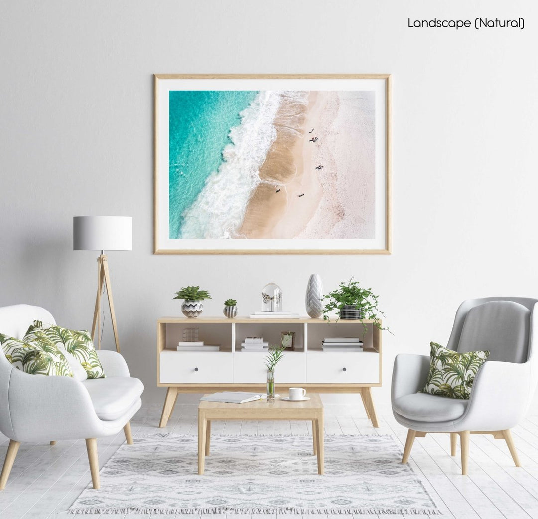 Aerial blue water and people walking on Camps Bay beach Cape Town in a natural fine art frame