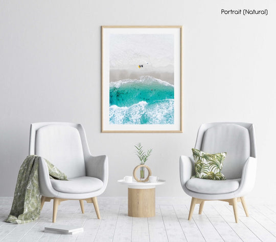 Aerial of two surfers sitting on Glen Beach in Cape Town in a natural fine art frame