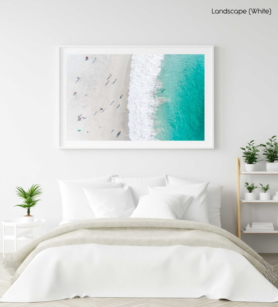 Aerial of green ocean at camps bay beach with people in cape town in a white fine art frame
