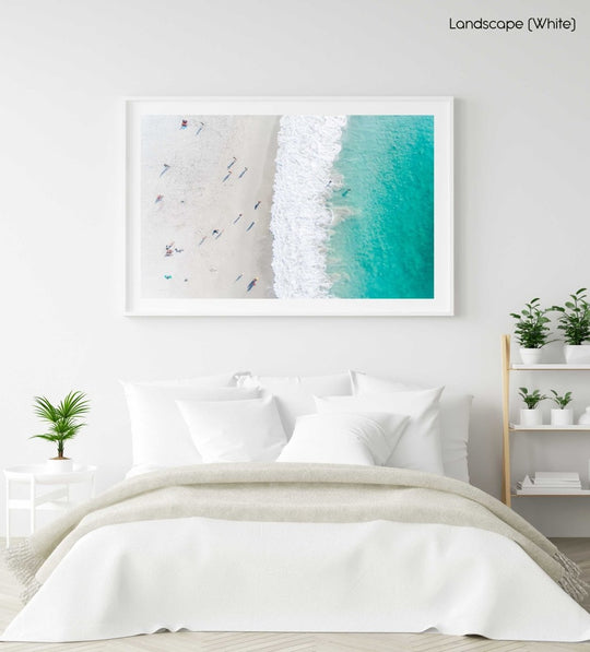 Aerial of green ocean at camps bay beach with people in cape town in a white fine art frame