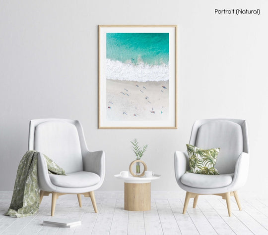 Aerial of green ocean at camps bay beach with people in cape town in a natural fine art frame