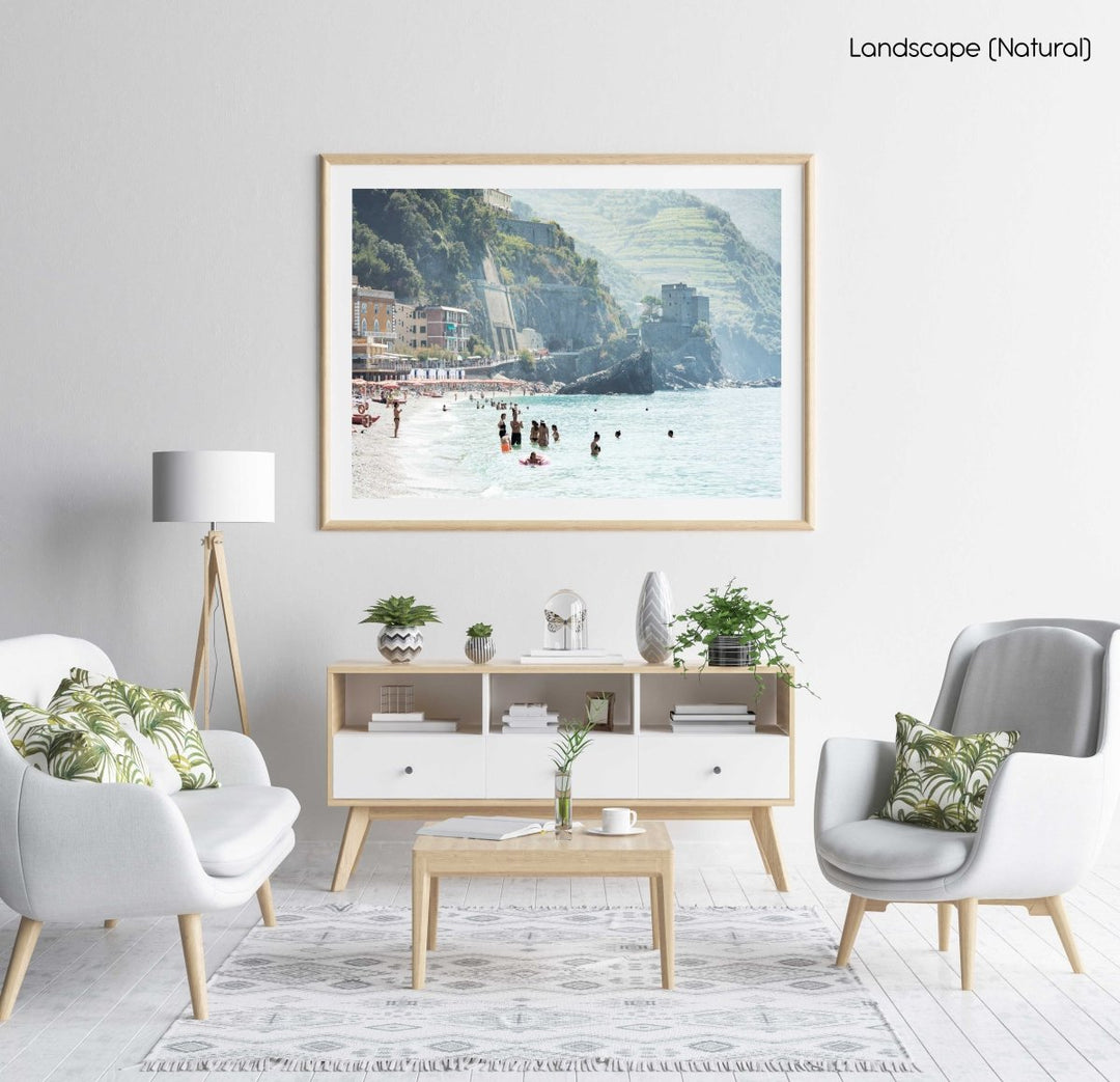 People swimming at castle and hills of Monterosso in Cinque Terre in a natural fine art frame