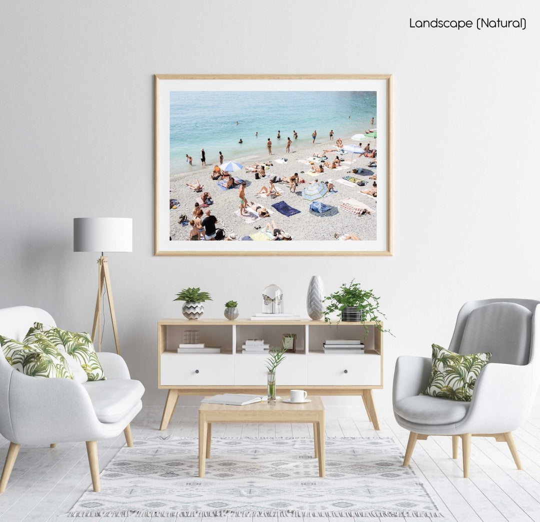 Beach goers lying on sand at italian beach in a natural fine art frame