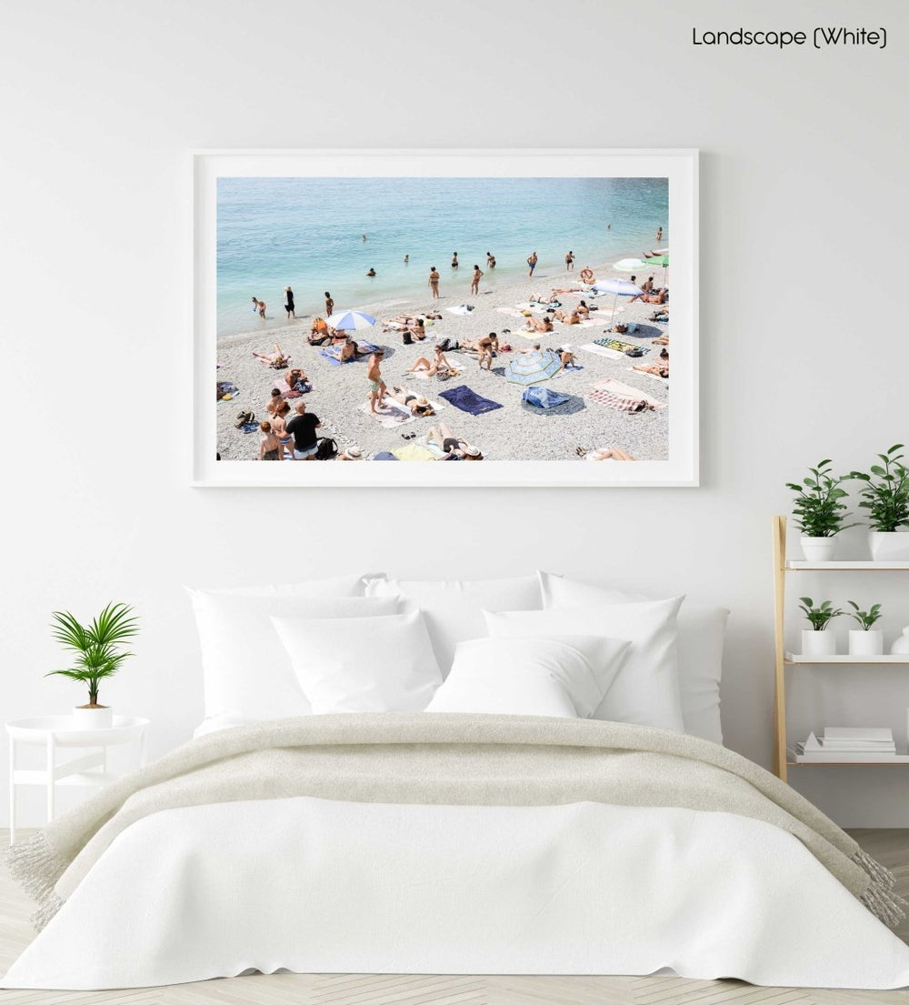 Beach goers lying on sand at italian beach in a white fine art frame