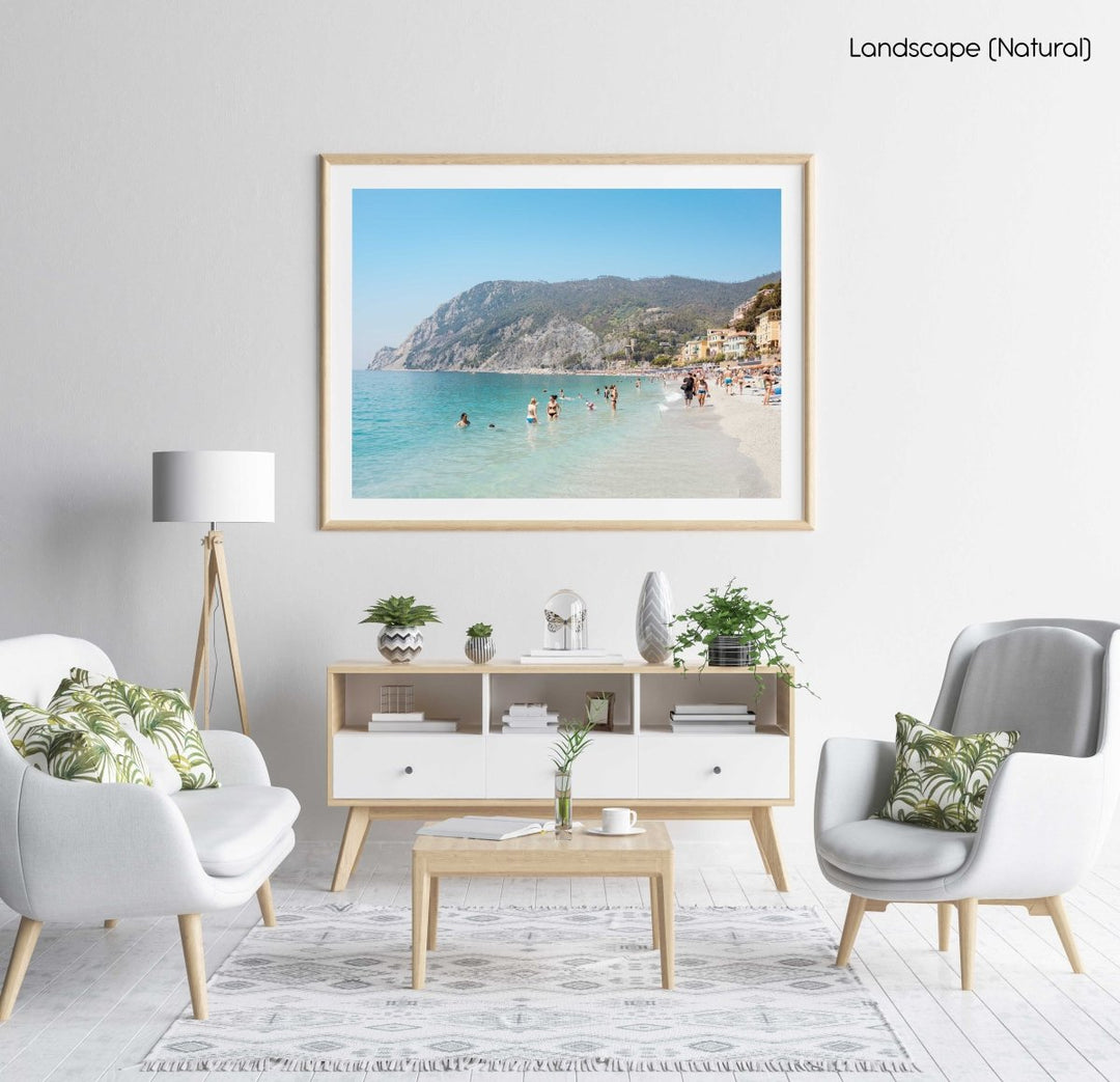 Hot sunny day with people swimming at Monterosso beach Italy in a natural fine art frame