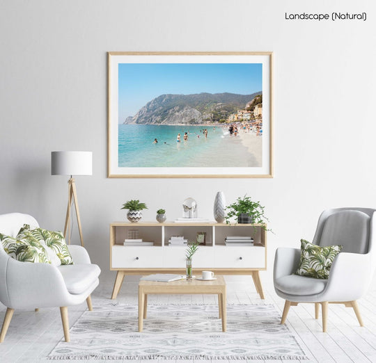 Hot sunny day with people swimming at Monterosso beach Italy in a natural fine art frame