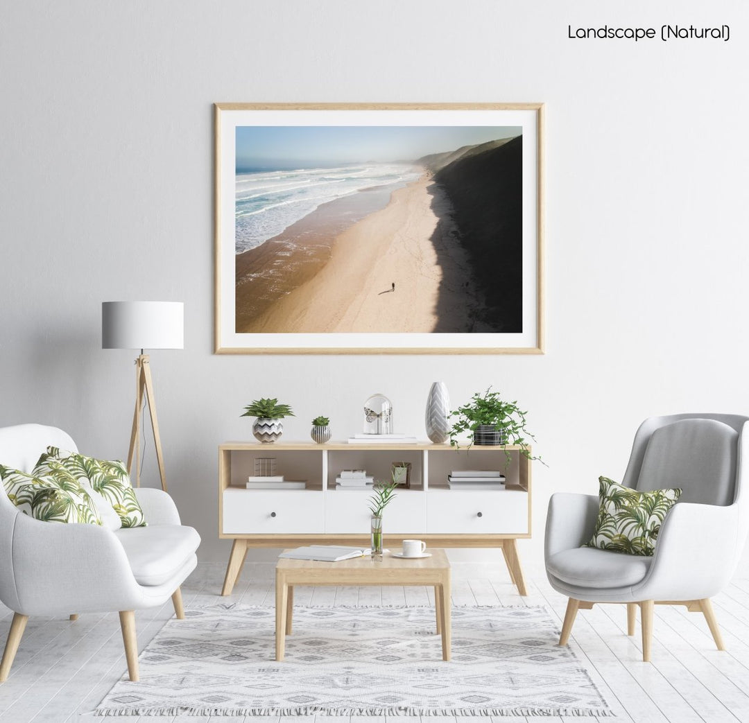 Aerial of person walking on brenton beach near Knysna