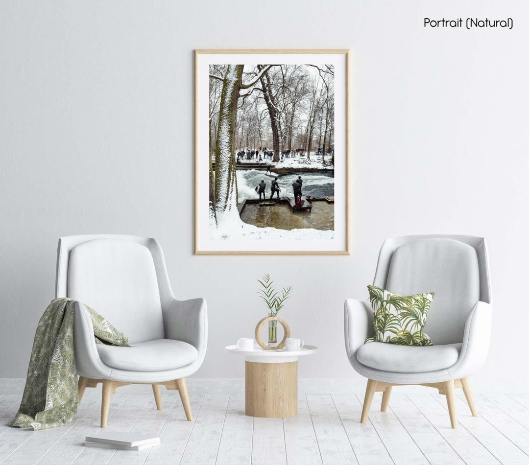 People surfing river wave in the city during snowfall in munich.