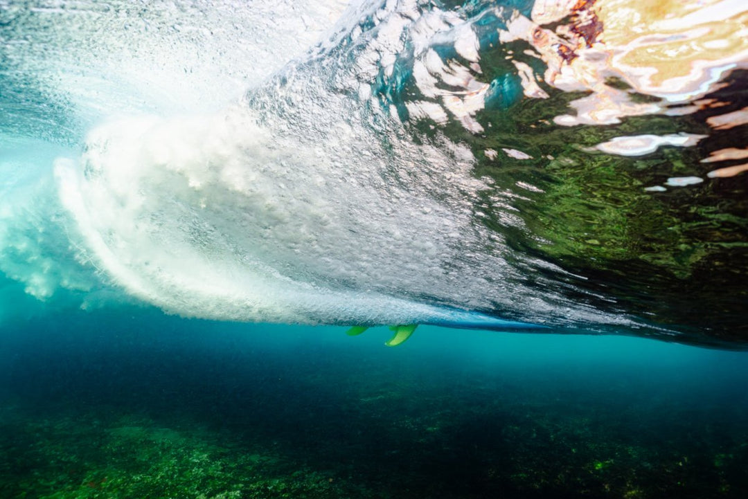 Surfer captured from underwater in Tofo, Mozambique