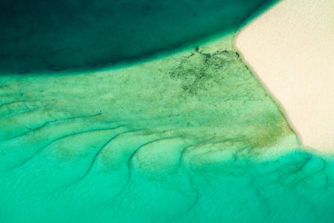 Abstract image of turquoise, green and blue textures by the sand and waters in Bazaruto Archipelago, Mozambique