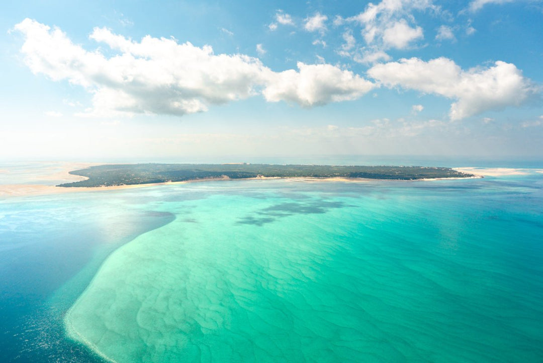 Aerial image taken on scenic helicopter flight of Benguerra island and its beautiful blue coast in Bazaruto Archipelago, Mozambique