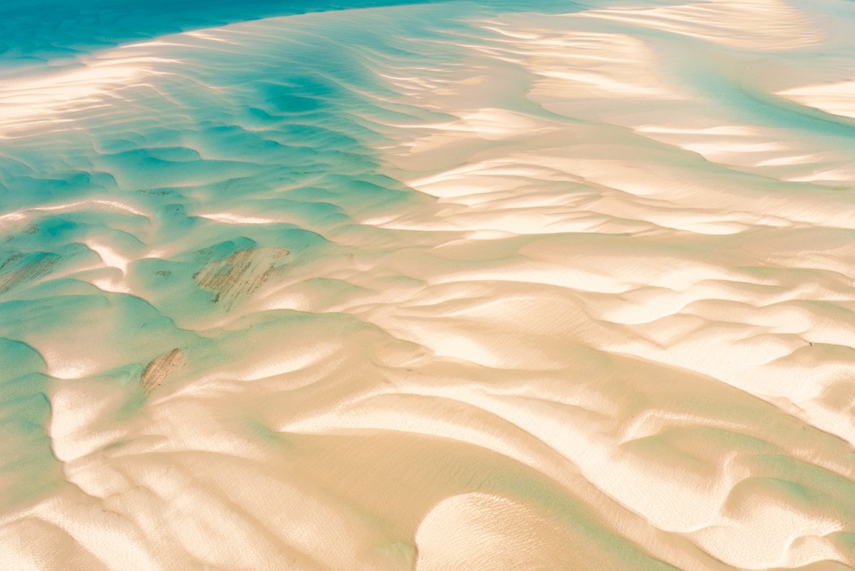 Aerial image of sand banks at low tide giving abstract shapes and a sense of flow in Bazaruto Archipelago, Mozambique