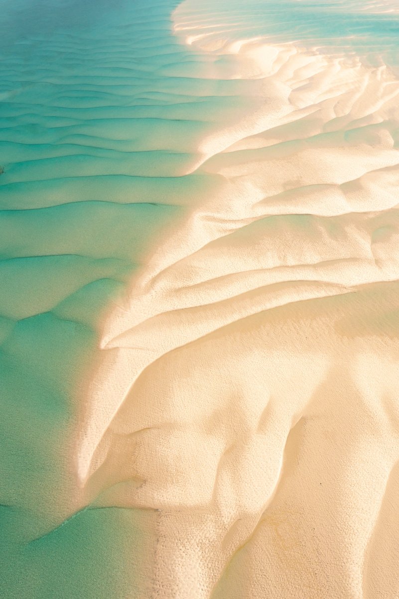 Textures and shapes of ocean and sand taken from an aerial perspective in Bazaruto Archipelago, Vilankulos, Mozambique