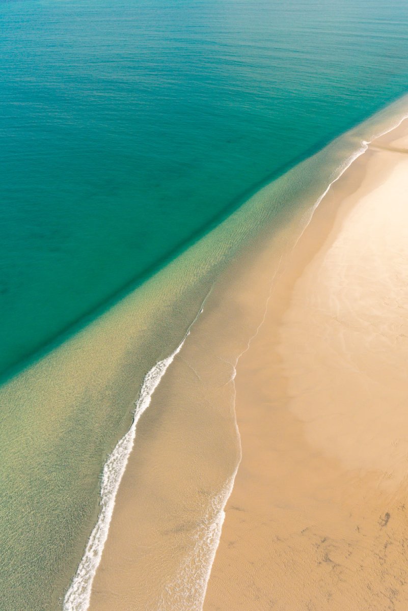 Lines formed by the sand and waves along the coast in Bazaruto Archipelago, Vilankulos, Mozambique