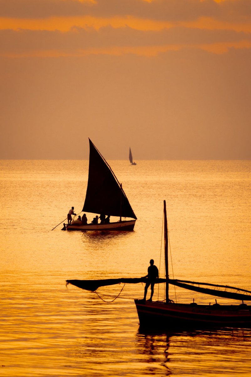 Orange and warm image of sailing dhows in Bazaruto Archipelago, Vilankulos, Mozambique