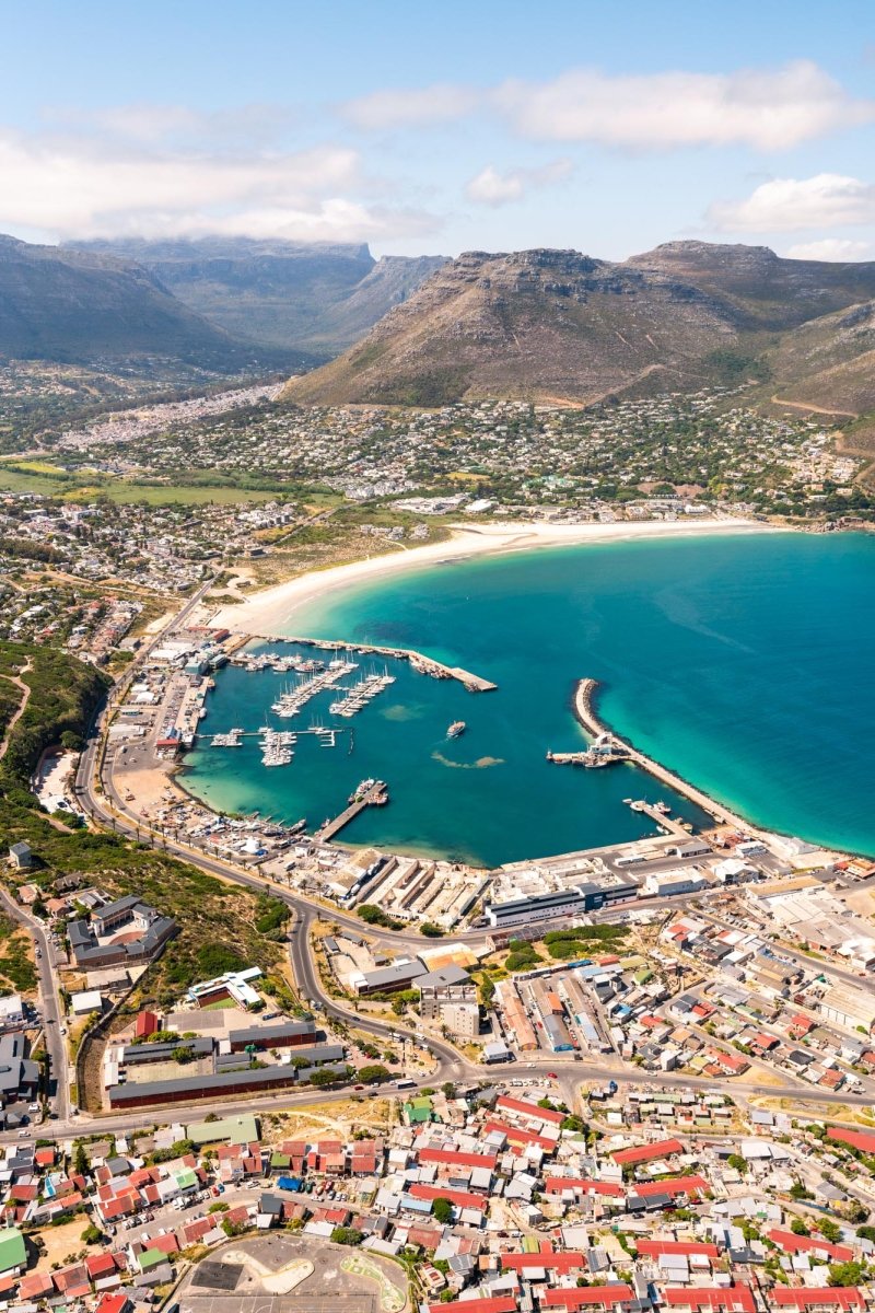 Aerial image taken of Hout Bay Harbour and its beach in Cape Town, South Africa.