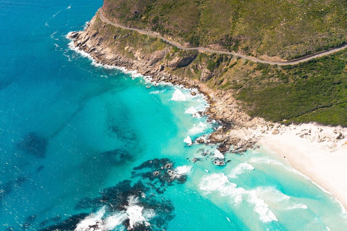 Aerial image of Chapman's Peak drive and Noordhoek Beach in Cape Town, South Africa.