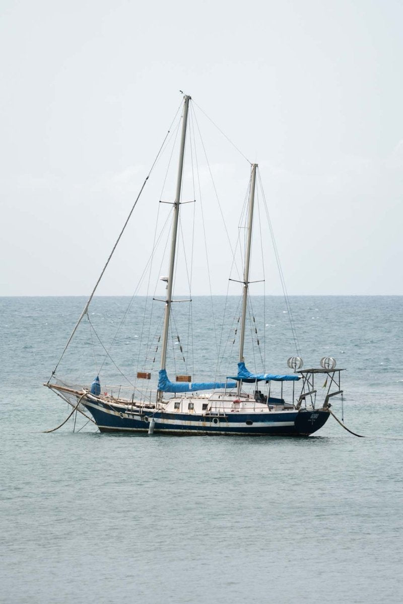 Sailing boat anchored in the sea along Sao Tome Island