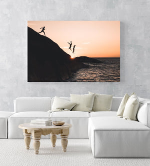 Three guys cliff jumping at sunset into ocean at Llandudno Beach in an acrylic/perspex frame