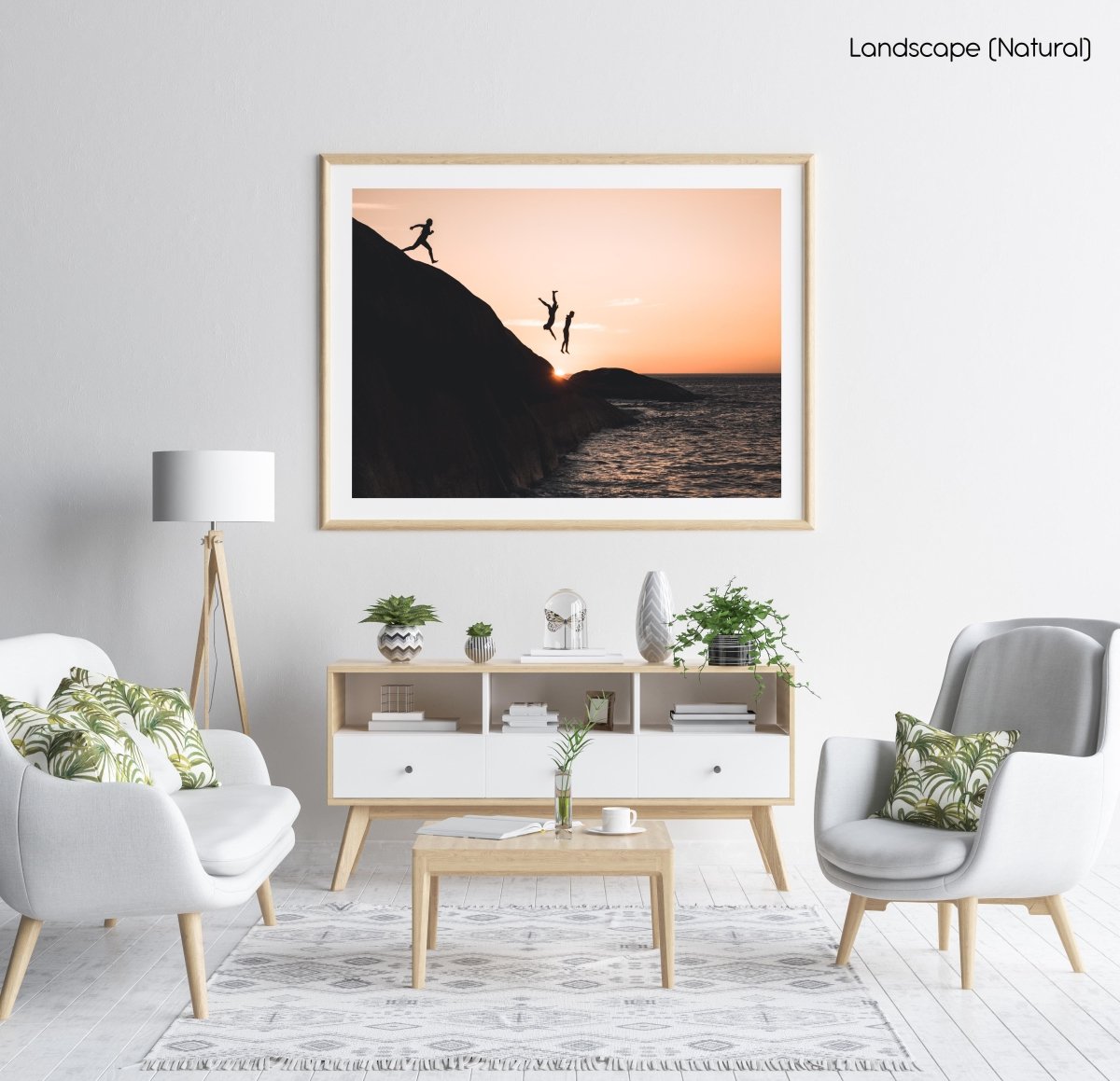 Three guys cliff jumping at sunset into ocean at Llandudno Beach in a natural fine art frame