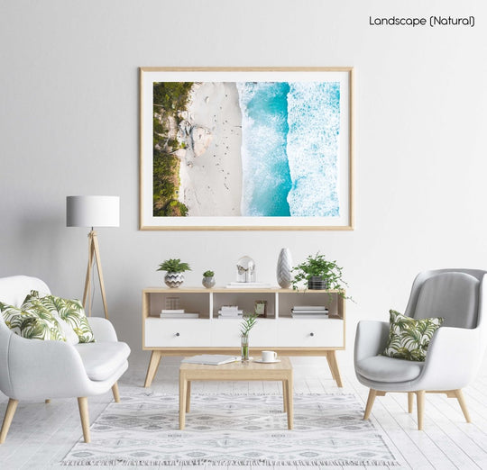 Aerial of Llandudno beach and waves crashing on sand in a natural fine art frame