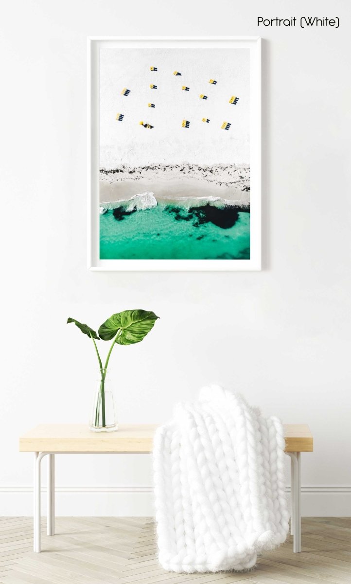 Aerial yellow beach chairs on Campsbay beach in Cape Town in a white fine art frame