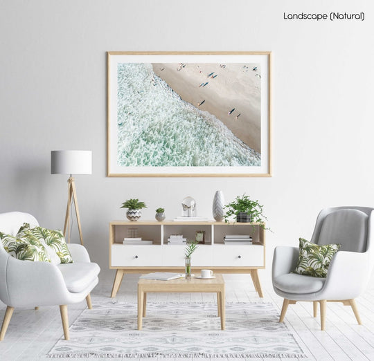 Aerial of swimmers at Llandudno beach in Cape Town during sunset in a natural fine art frame