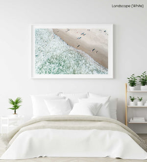 Aerial of swimmers at Llandudno beach in Cape Town during sunset in a white fine art frame