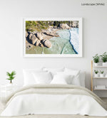 Aerial hightide waves flowing along beach boulders at Llandudno Beach in Cape Town in a white fine art frame