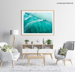 Three people surfing blue wave in Cape Town from above in a natural fine art frame