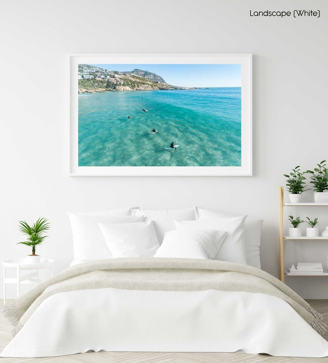 Aerial of surfers waiting on surfboards for a wave at Llandudno Beach in a white fine art frame