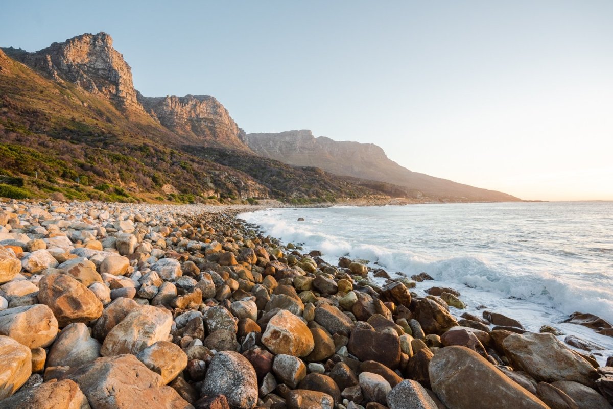 Pebbles and the sea at the twelve apostles mountains in Cape Town