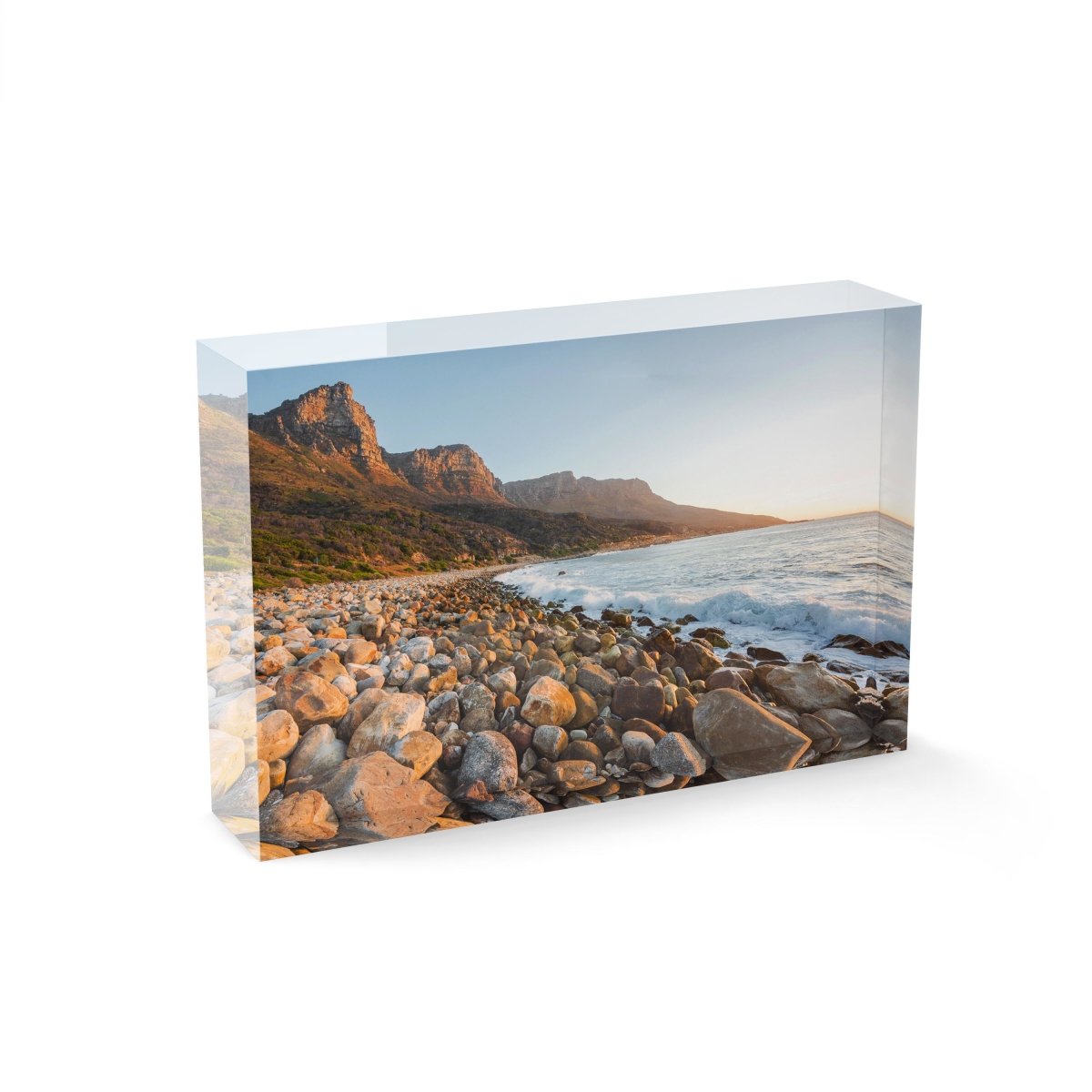 Pebbles and the sea at the twelve apostles mountains in Cape Town