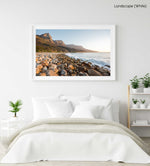 Pebbles and the sea at the twelve apostles mountains in Cape Town in a white fine art frame