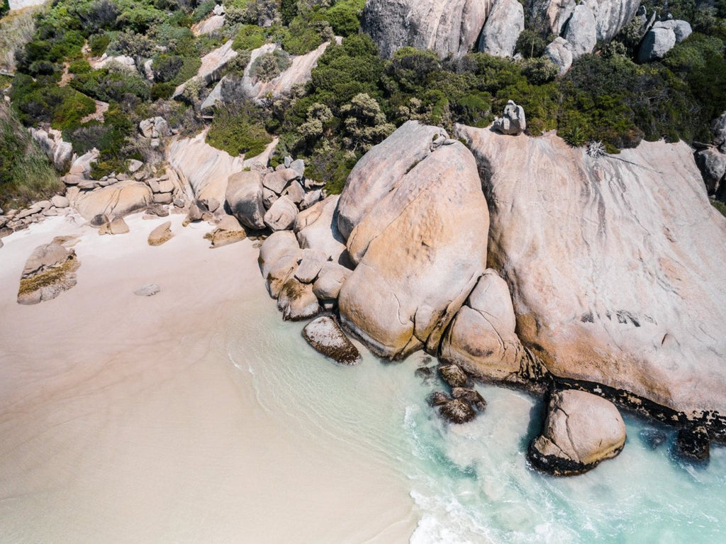 Aerial of boulders and beach in Cape Town