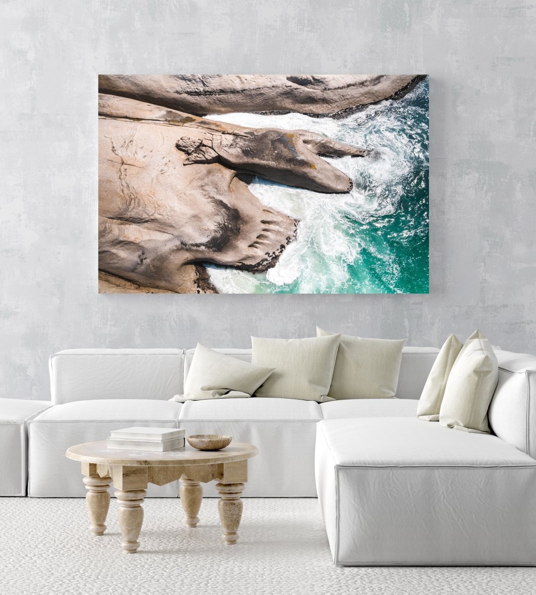 Modern shaped boulders in the ocean in Cape Town aerial in an acrylic/perspex frame