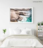 Modern shaped boulders in the ocean in Cape Town aerial in a white fine art frame