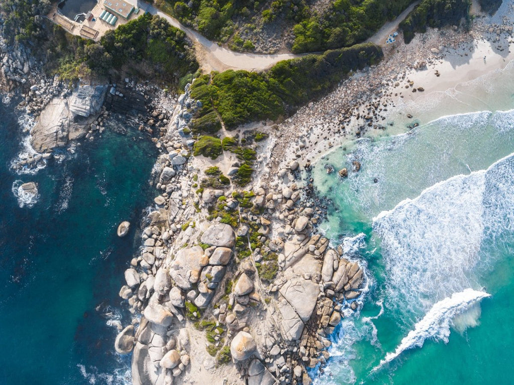 Aerial boulders in sea in Llandudno Beach Cape Town