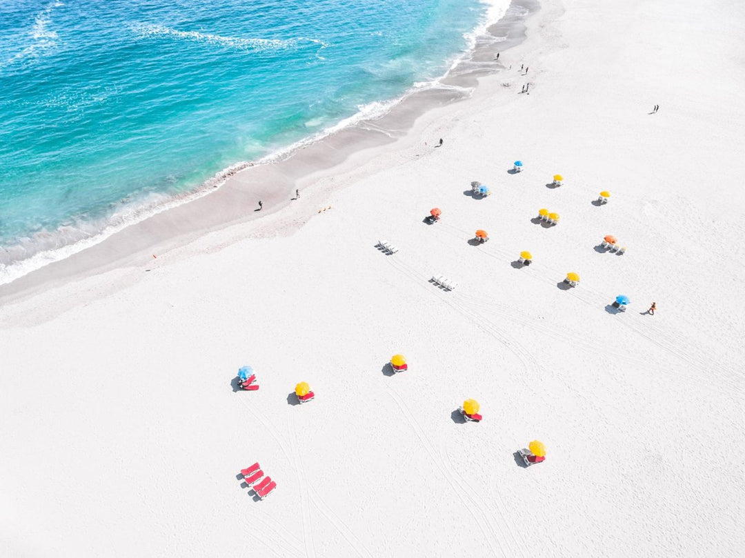 Aerial of colorful beach chairs on Camps Bay beach Cape Town