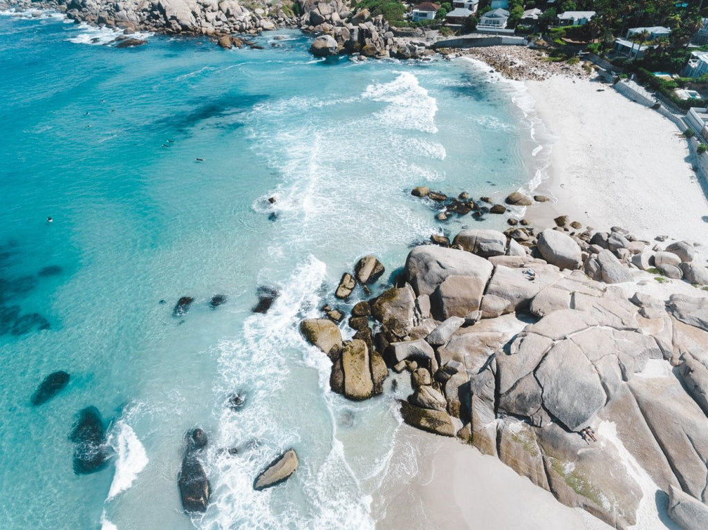 Aerial of blue Glen Beach surf in Cape Town