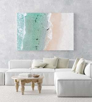 Aerial topdown of surfer walking out of water in Cape Town in a white fine art frame