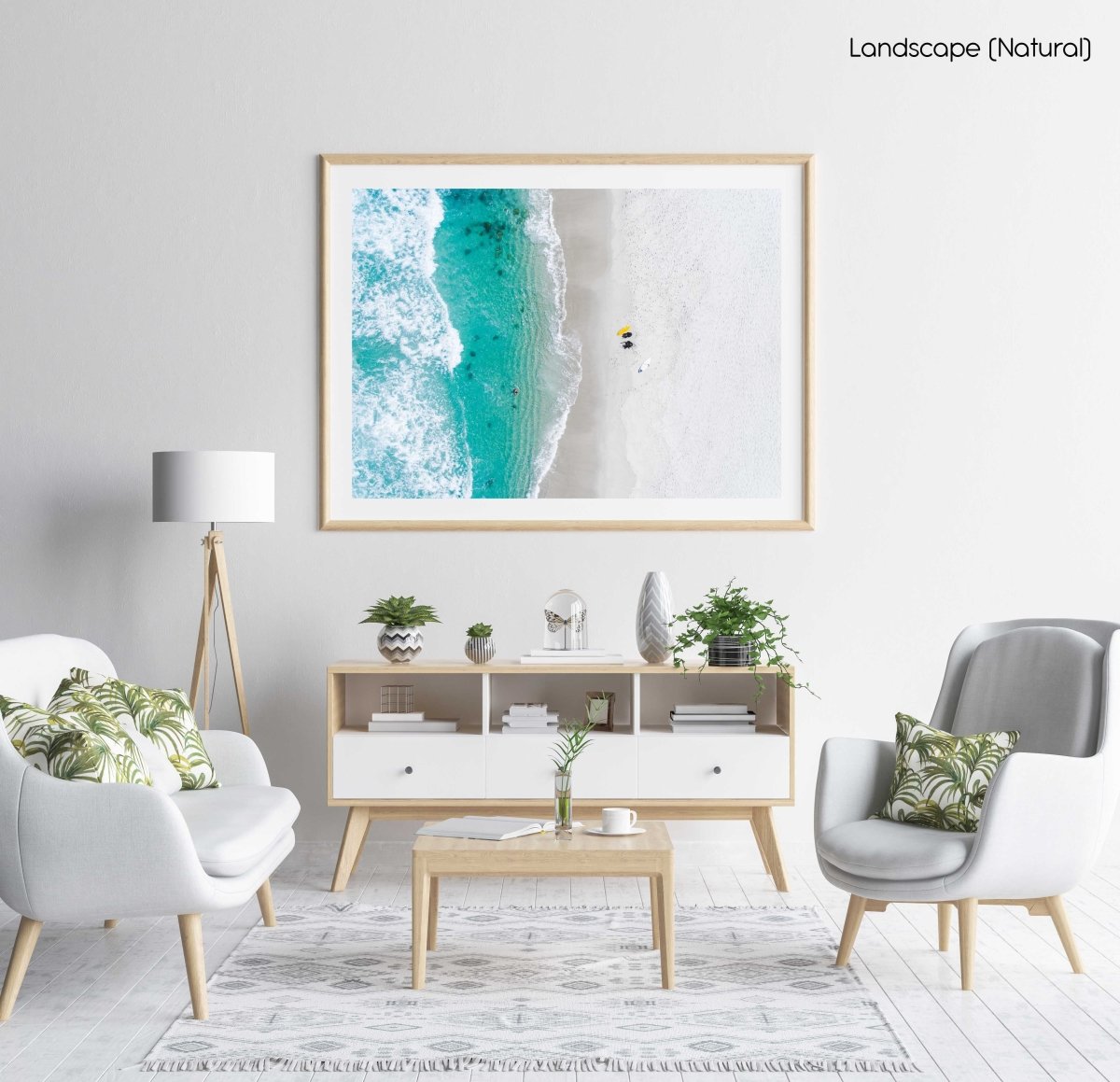 Aerial of two surfers sitting on Glen Beach in Cape Town in a natural fine art frame