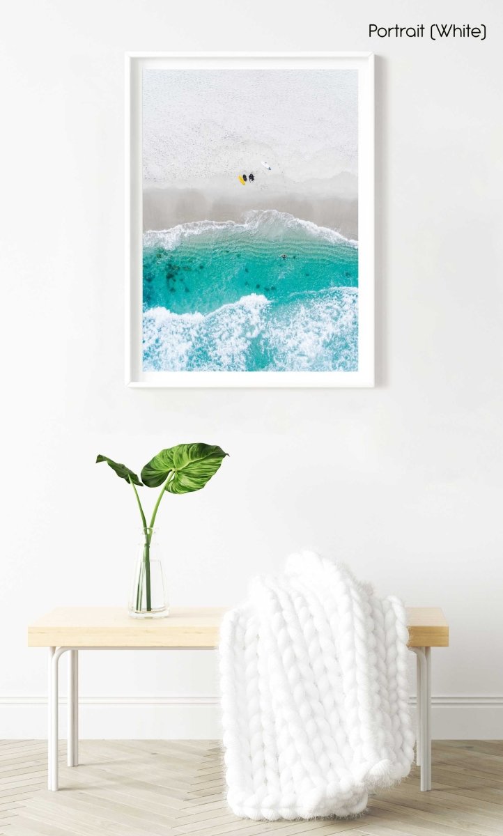 Aerial of two surfers sitting on Glen Beach in Cape Town in a white fine art frame