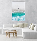Aerial of two surfers sitting on Glen Beach in Cape Town in a natural fine art frame
