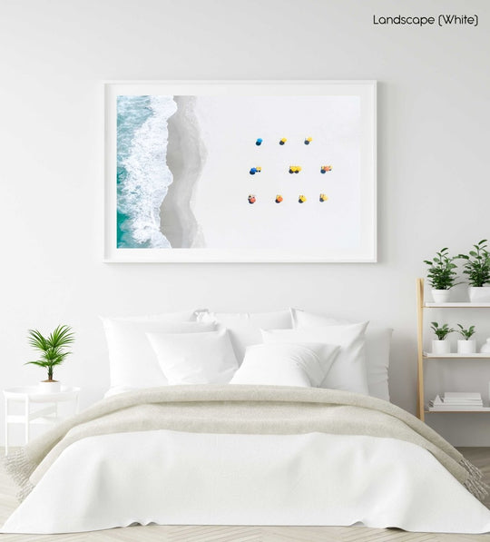 Aerial of colorful umbrellas aligned on camps bay beach in cape town in a white fine art frame