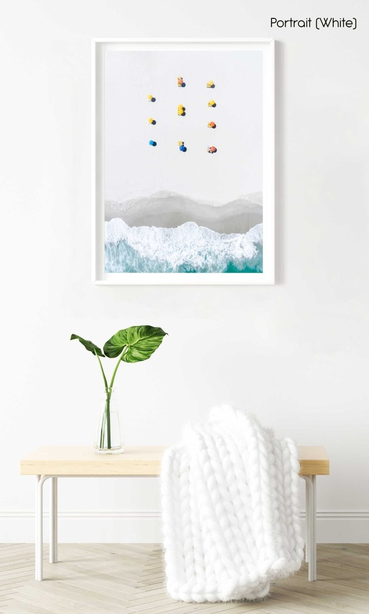 Aerial of colorful umbrellas aligned on camps bay beach in cape town in a white fine art frame