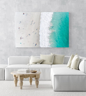 Aerial of green ocean at camps bay beach with people in cape town in a white fine art frame