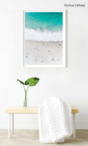 Aerial of green ocean at camps bay beach with people in cape town in a white fine art frame