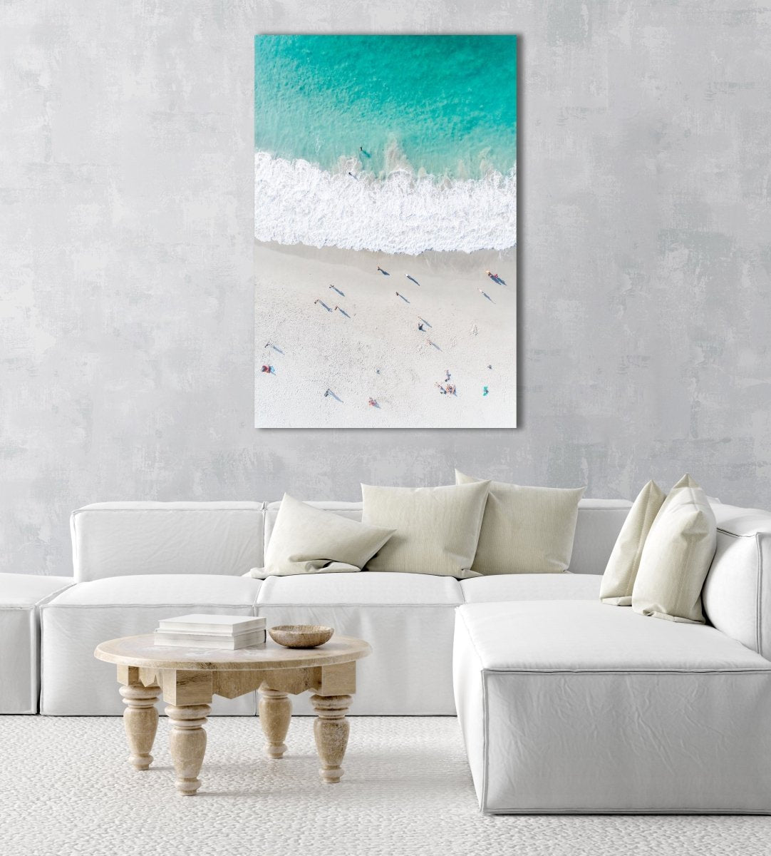 Aerial of green ocean at camps bay beach with people in cape town in a natural fine art frame